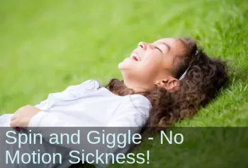 Girl on grass, laughing. Text: Spin and giggle - No motion sickness!