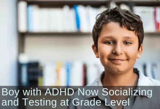 Boy smiling into camera. Text: Boy with ADHD now socializing and testing at grade level. Links to case study.