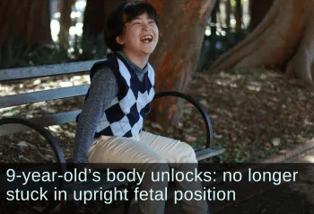 Laughing boy sitting on a bench. Text: 9-year-old's body unlocks: no longer stuck in upright fetal position.
