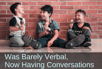 Three boys giggling in the school hallway. Text: Was barely verbal, now having conversations.