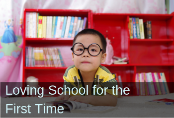 Boy looking into camera. Text: Loving School for the First Time.