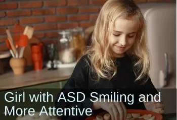 Young, smiling girl working in the kitchen. Text: Girl with ASD Smiling and more attentive.