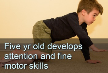 Boy on all fours. Text: 5-Year-Old develops attention and fine motor skills.