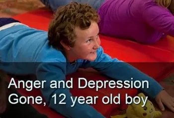 Smiling boy stretching bell-down on a mat. Text: Anger and Depression Gone, 12-year-old boy.