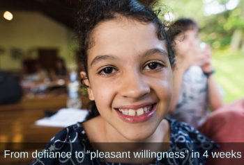 Young girl looking into camera. Text: From defiance to “pleasant willingness” in 4 weeks.