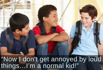 Three preteen boys chatting at school. Text: "Now I don't get annoyed by loud things...I'm a normal kid!" 