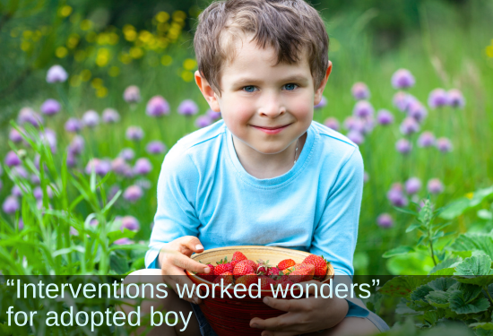 Smiling boy with a bowl of cherries. Text: “Interventions worked wonders” for adopted boy