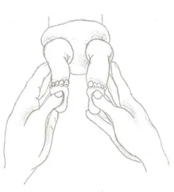 Adult hands gently touching the balls of the feet on an infant