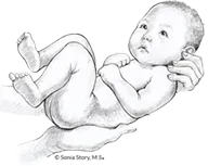 Baby cradled in gentle adult hands.