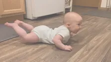 Infant in Prone Position on the floor_expressing Landau refelx
